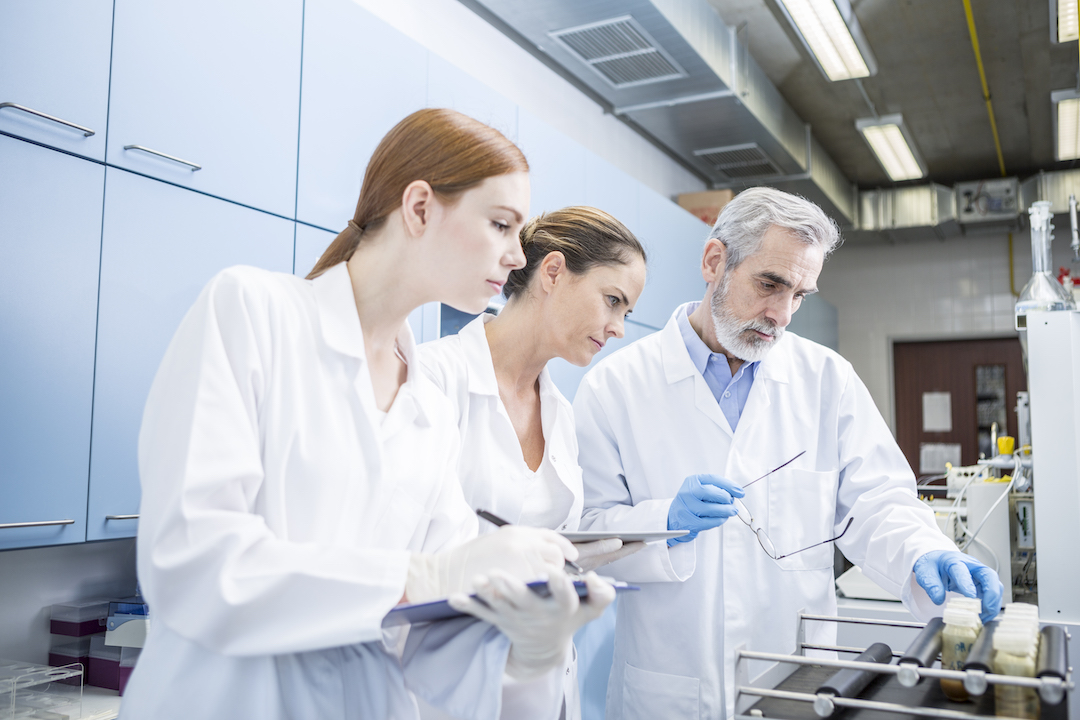 three-scientists-in-lab-examining-samples